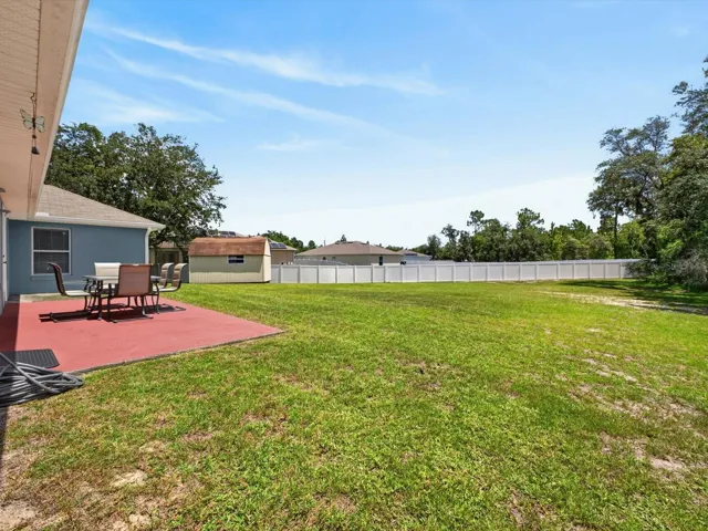 Large patio overlooks big backyard