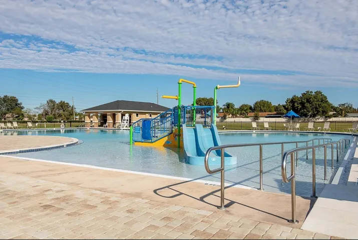 Resort-style pool with slides