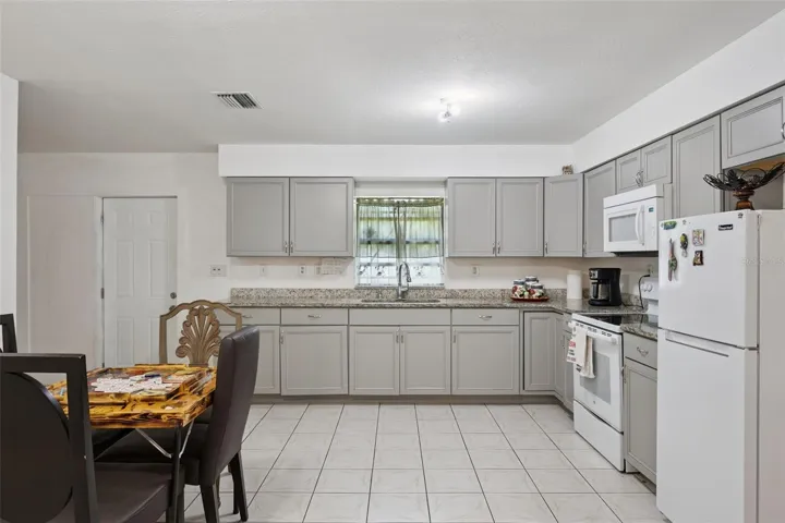 Large kitchen with renovated cabinets and counter tops