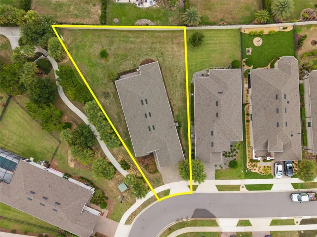 Drone view of the rear. This home is on a Premium Oversized Lot demonstrating the approximate property lines