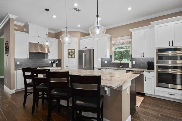 A beautiful open kitchen offers plenty of space