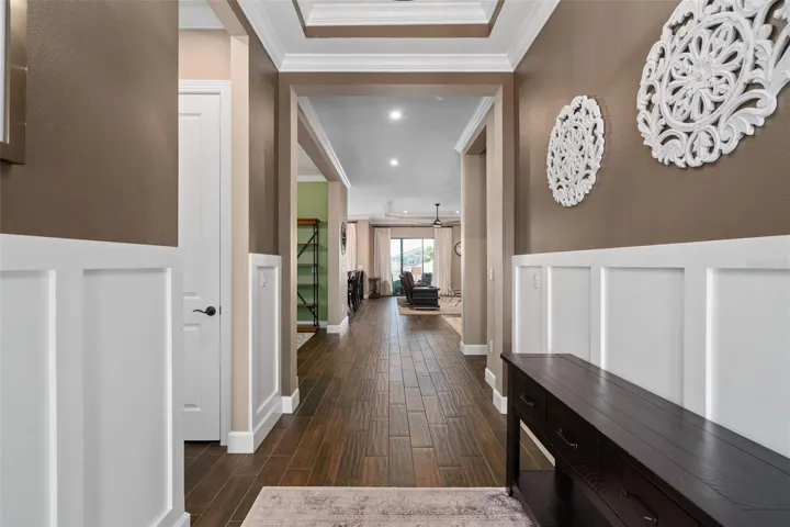 Upon entry you will find Custom Wall Woodwork and a beautiful see-through floor plan.