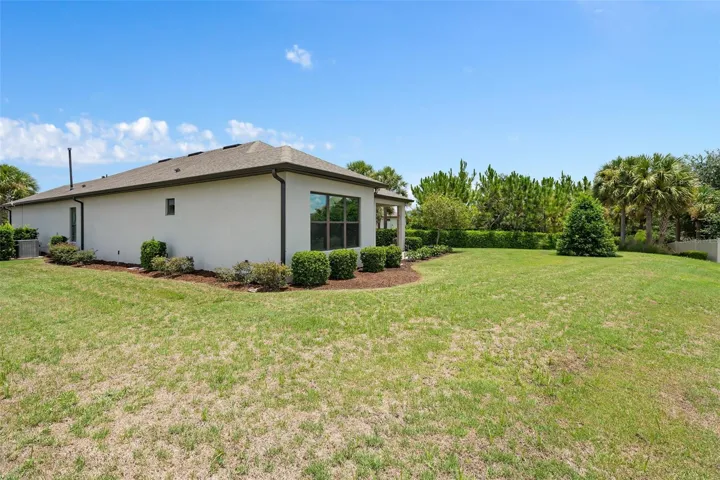 Rear/Side view of the home. Plenty of Rear Yard Space too.