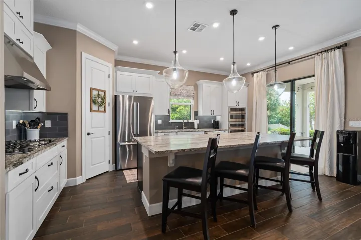 The Gourmet Kitchen Option includes Cafe' Built-in Stainless Appliance Package. The Microwave and Oven are Convection too. A Bosch Stainless Steel Cabinet Depth Refrigerator is included