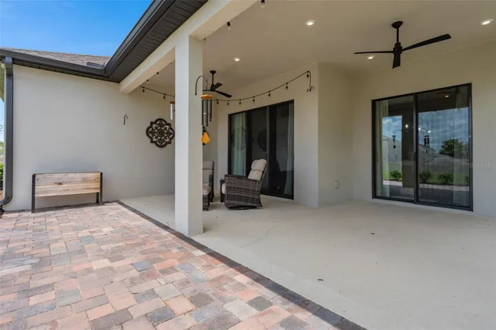Large Under Roof Lanai with a paver patio