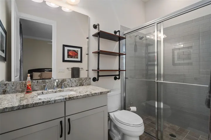 Bedroom 2 En-Suite features Upgraded Comfort Height Vanity, Leathered Granite and Upgraded Floor and Wall Tile.