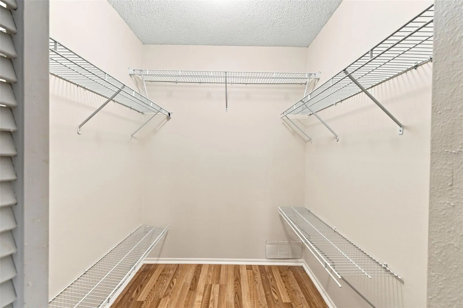 Primary bedroom with walk in closet.