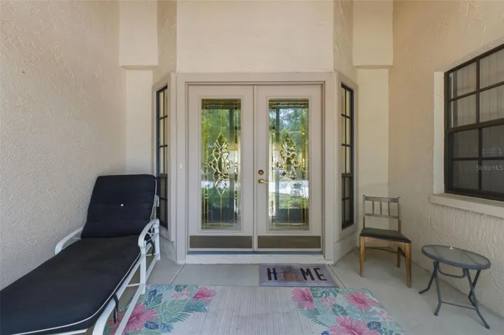 Screened front patio.