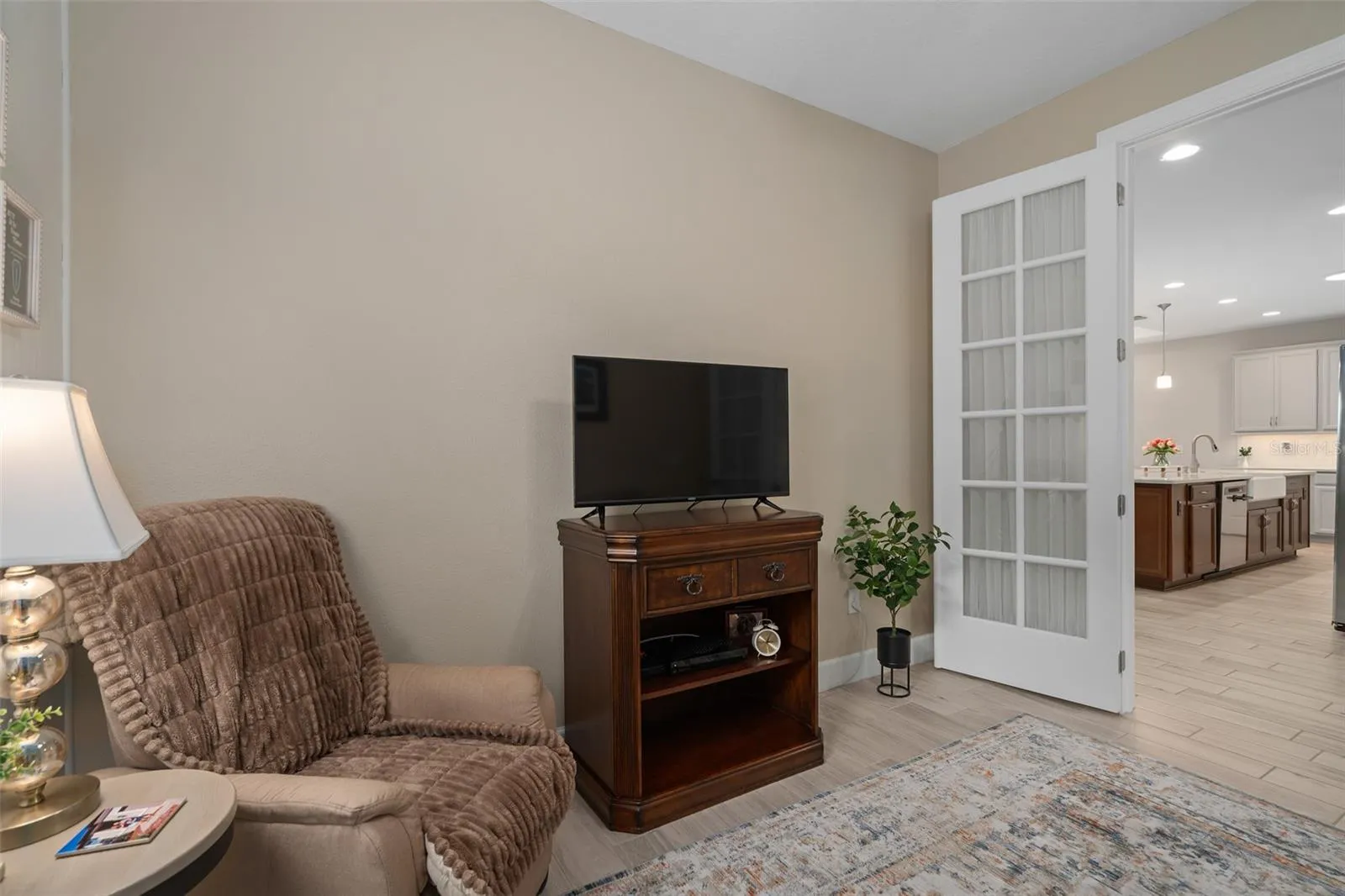 The Flex Room is suitable as an Office/Study/Den and offers Glass French Doors