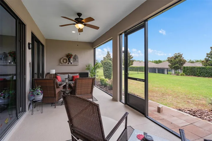 A Spacious Under Roof Lanai with Views of the Fenced Rear Yard