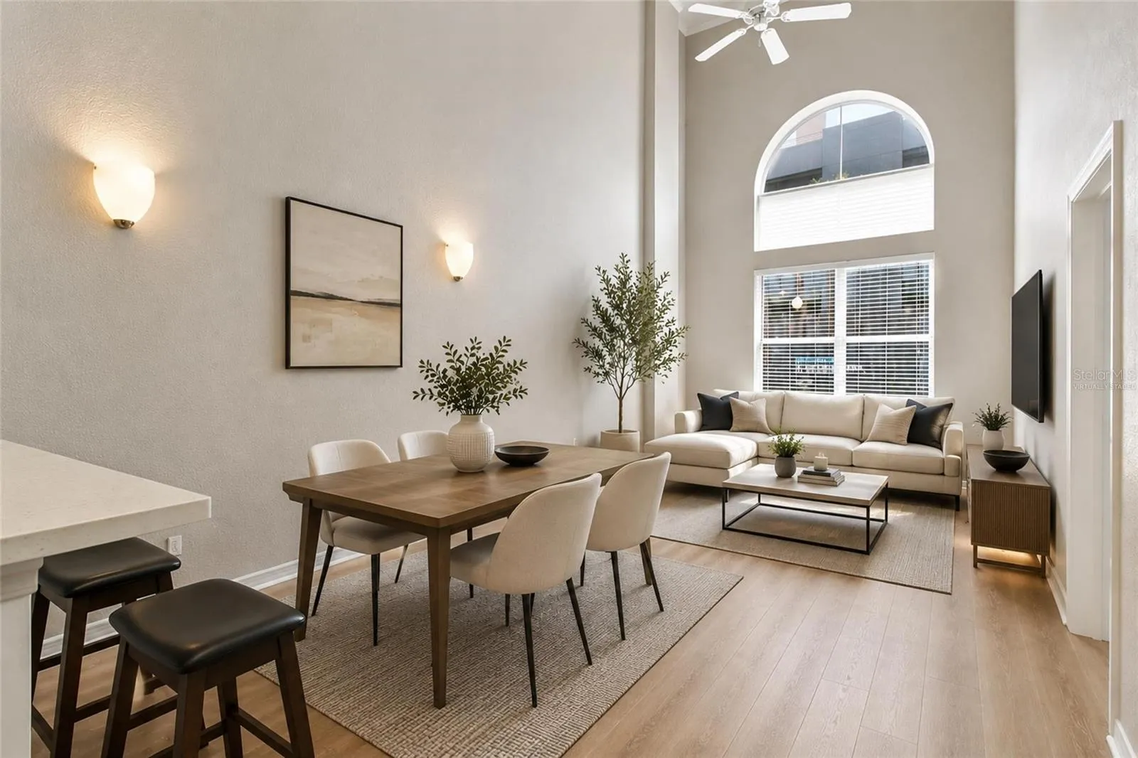 Virtually Staged -Open Concept view of family room, dining, and 18ft tall ceilings