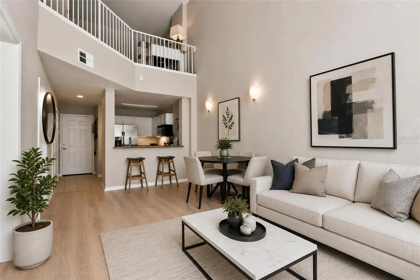 Virtually Staged - Open Concept view of family room, dining, kitchen and 18ft tall ceilings, loft