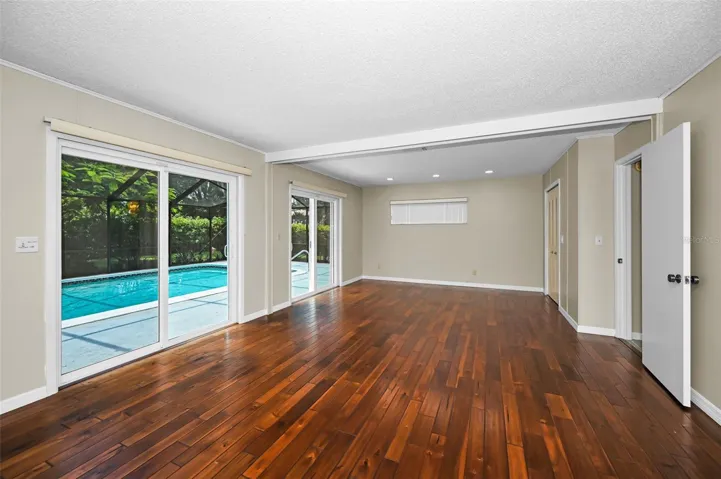 Lower level Family Room with Sliding Glass doors to the pool area