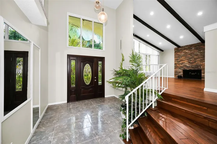Foyer with soaring, vaulted ceiling entry