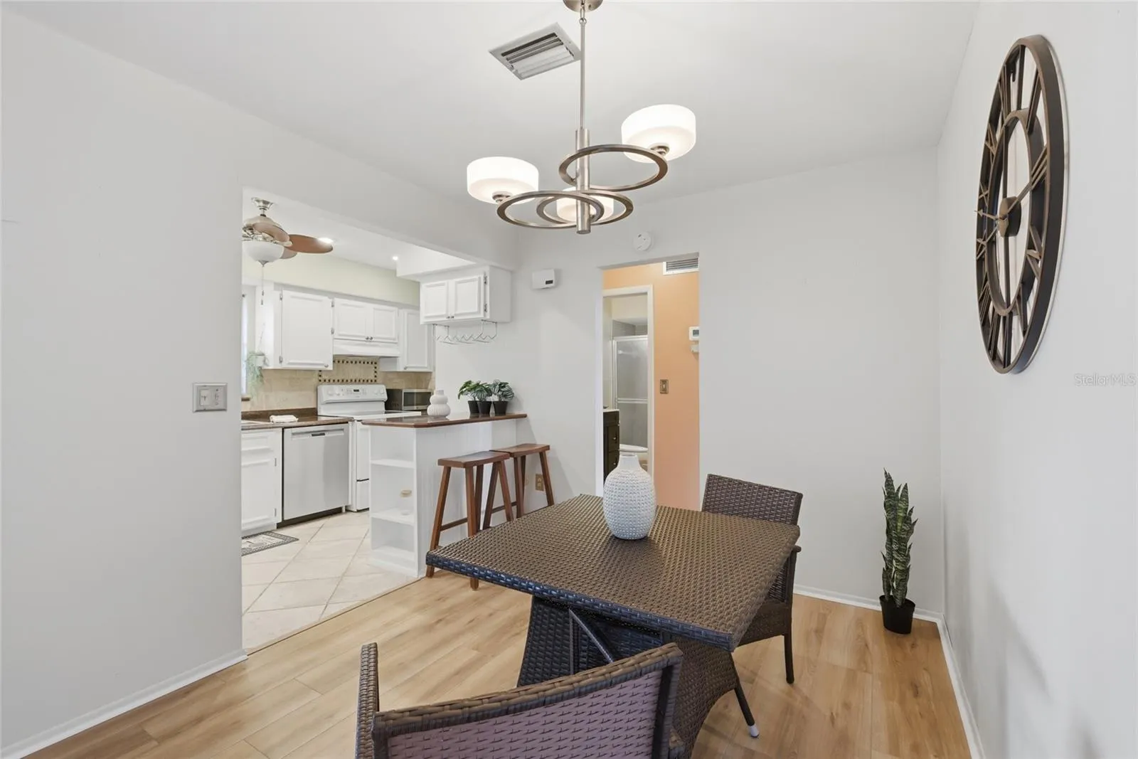 Dining into kitchen, which features a Bosch dishwasher.