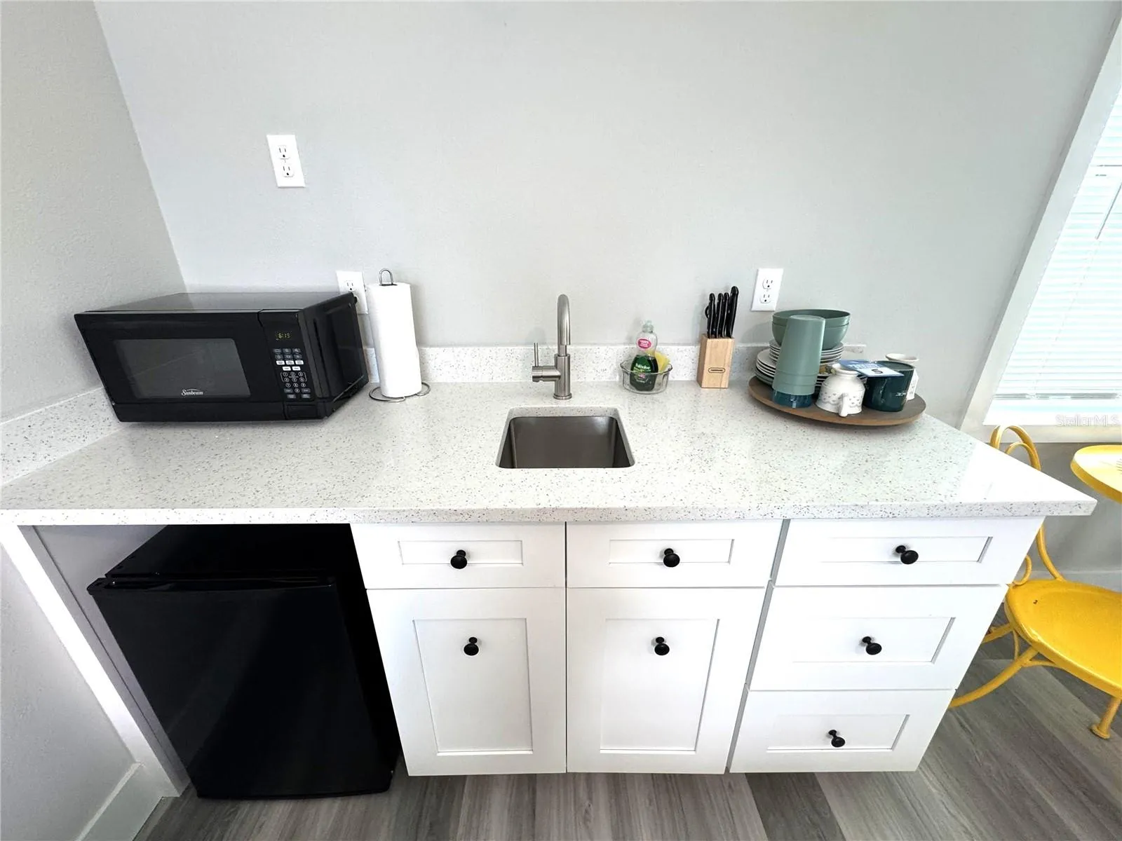 Sink, mini fridge, microwave.