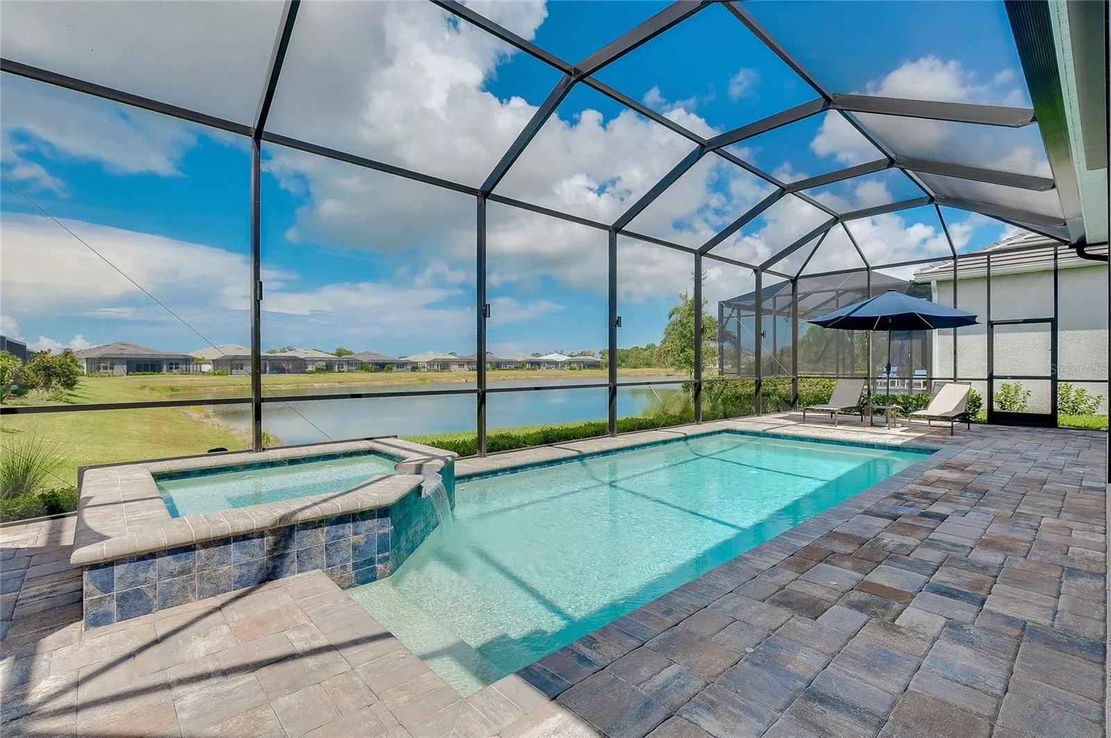Pool/Spa with water view.