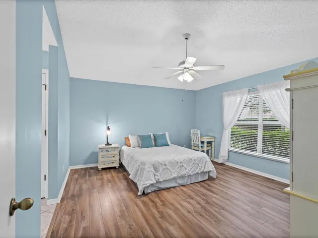 Primary Bedroom with luxury vinyl plank flooring throughout