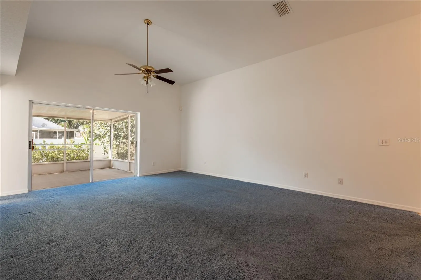 Vaulted ceiling in the living room. Freshly painted interior.