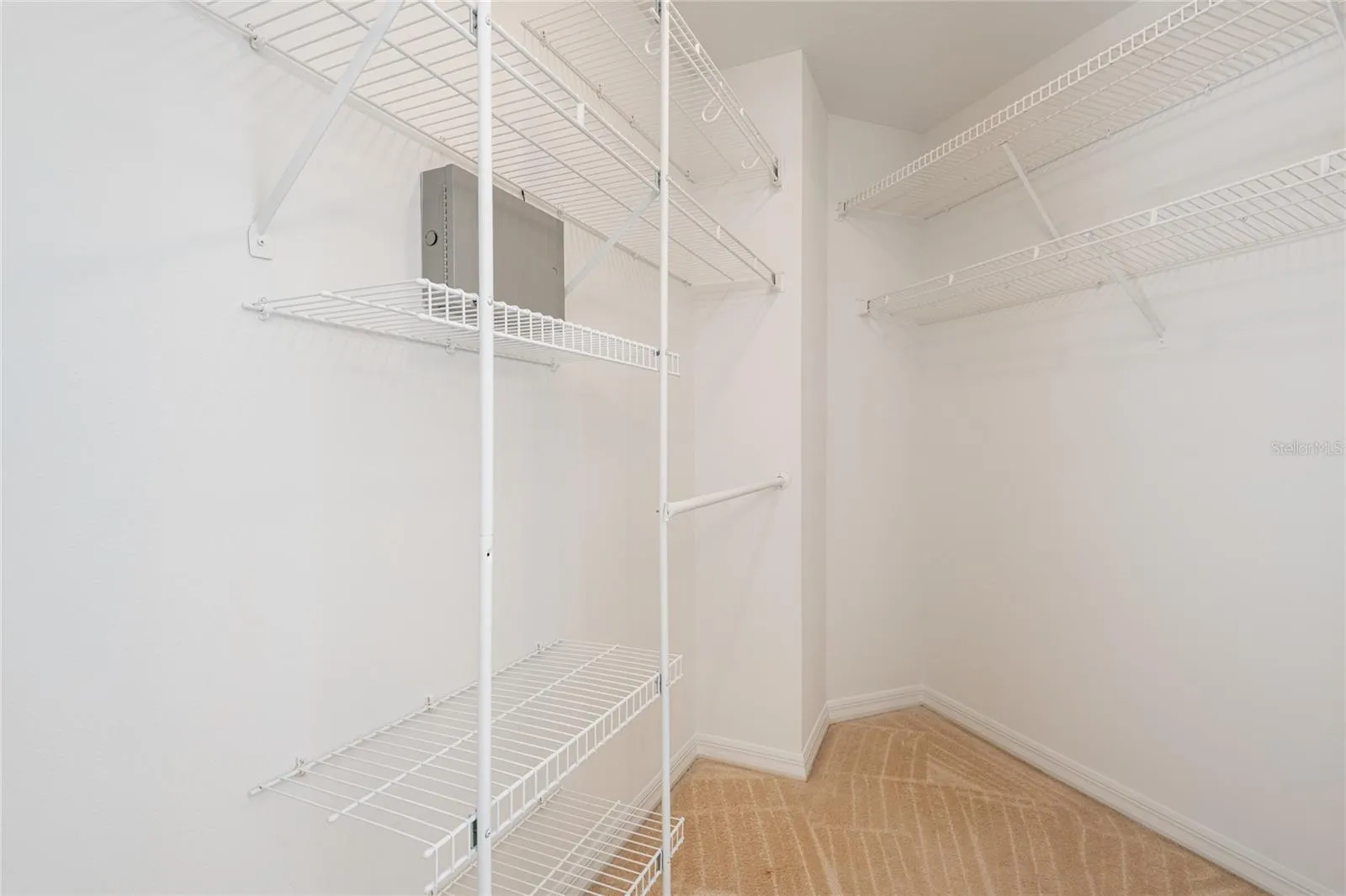 Walk-in primary bedroom closet
