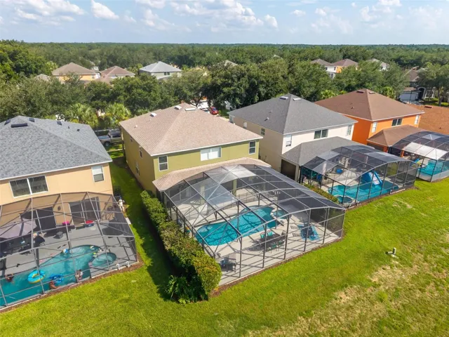 One of the Only Double Lots with TWICE the Backyard Social Space Around the Pool.