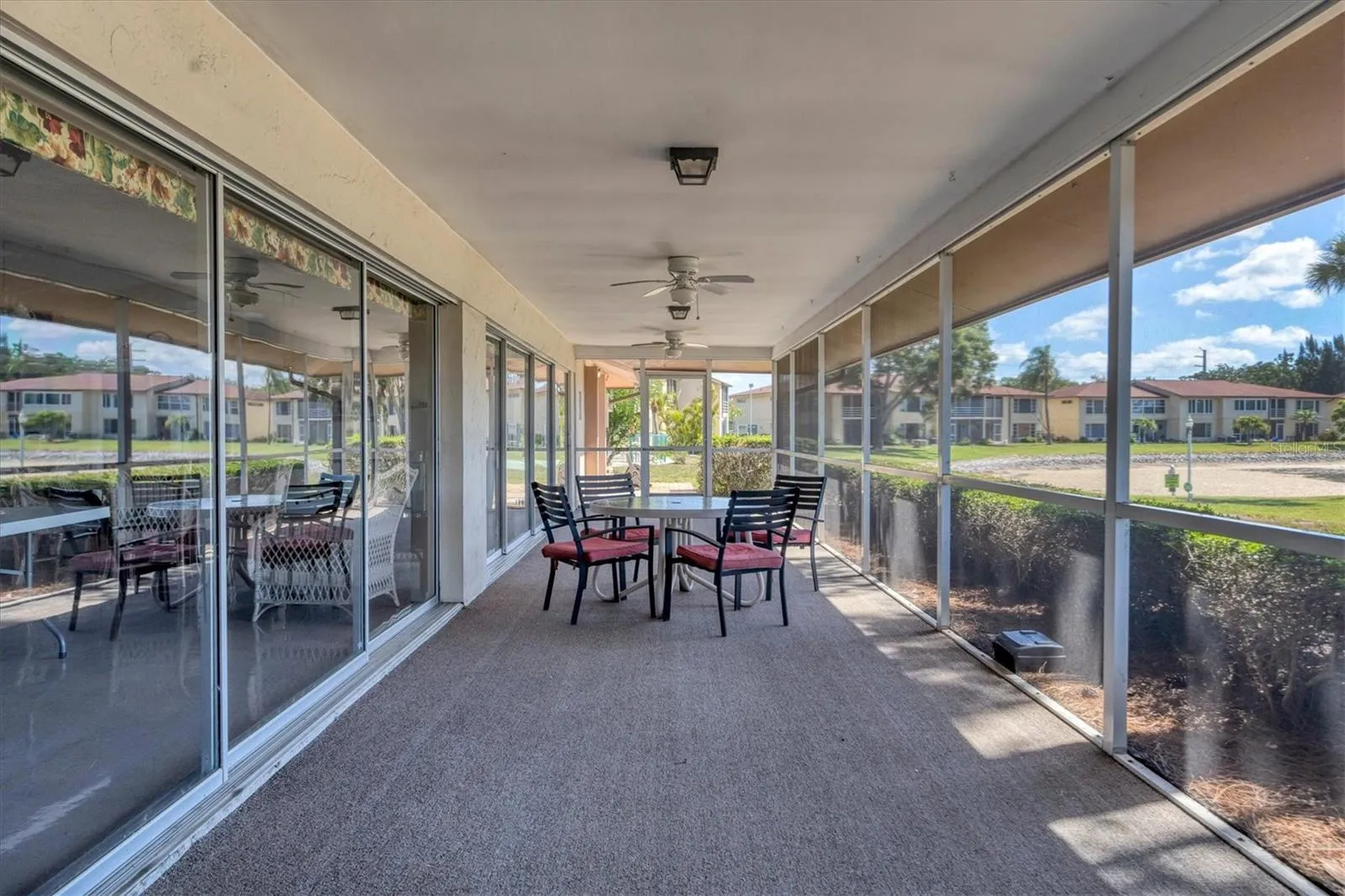Clubhouse covered lanai overlooks large lake
