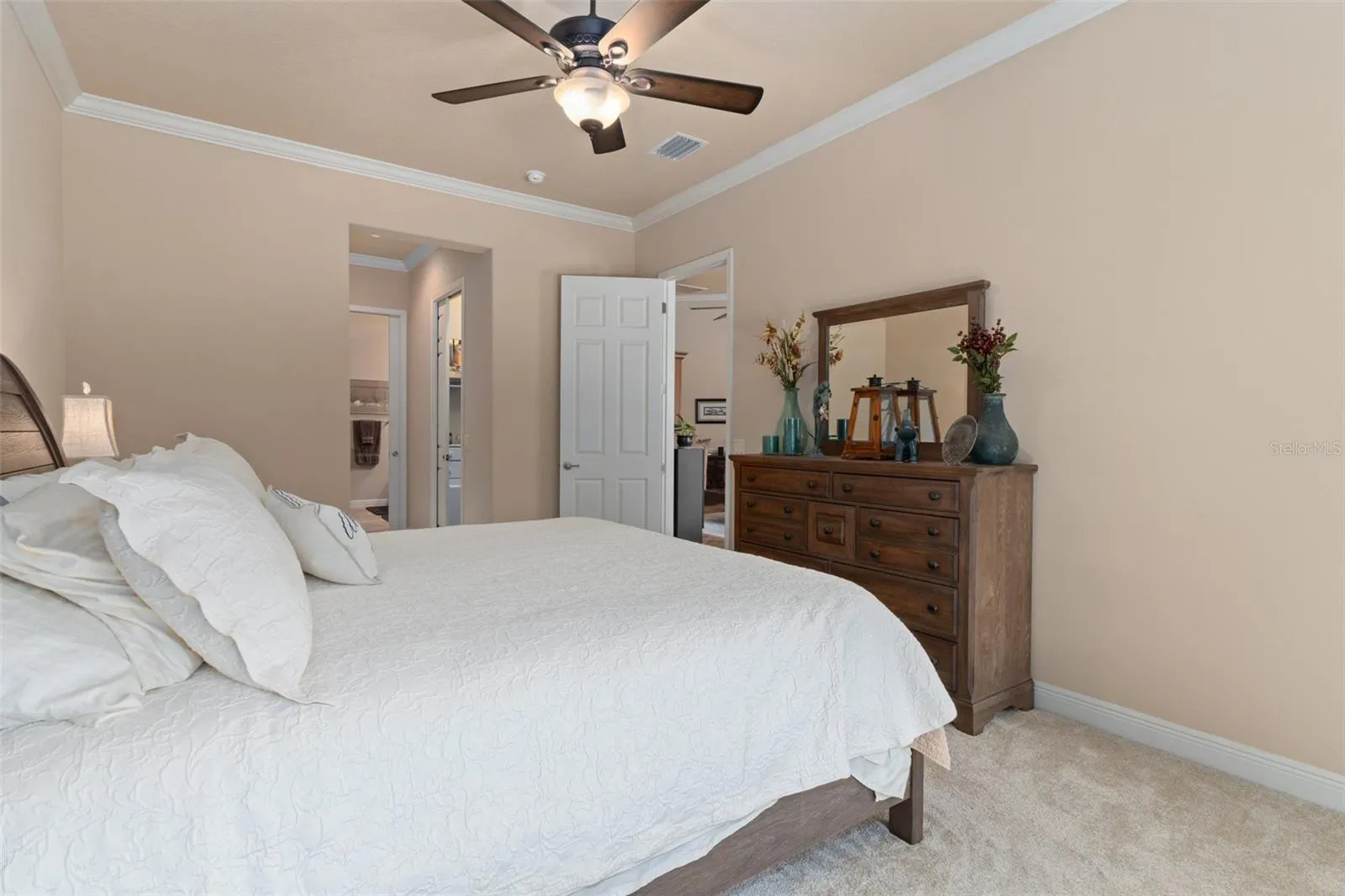 The view across the Primary bedroom from the Bay Window. The opening left of center leads to 2 Primary Closets and the Primary Bath.