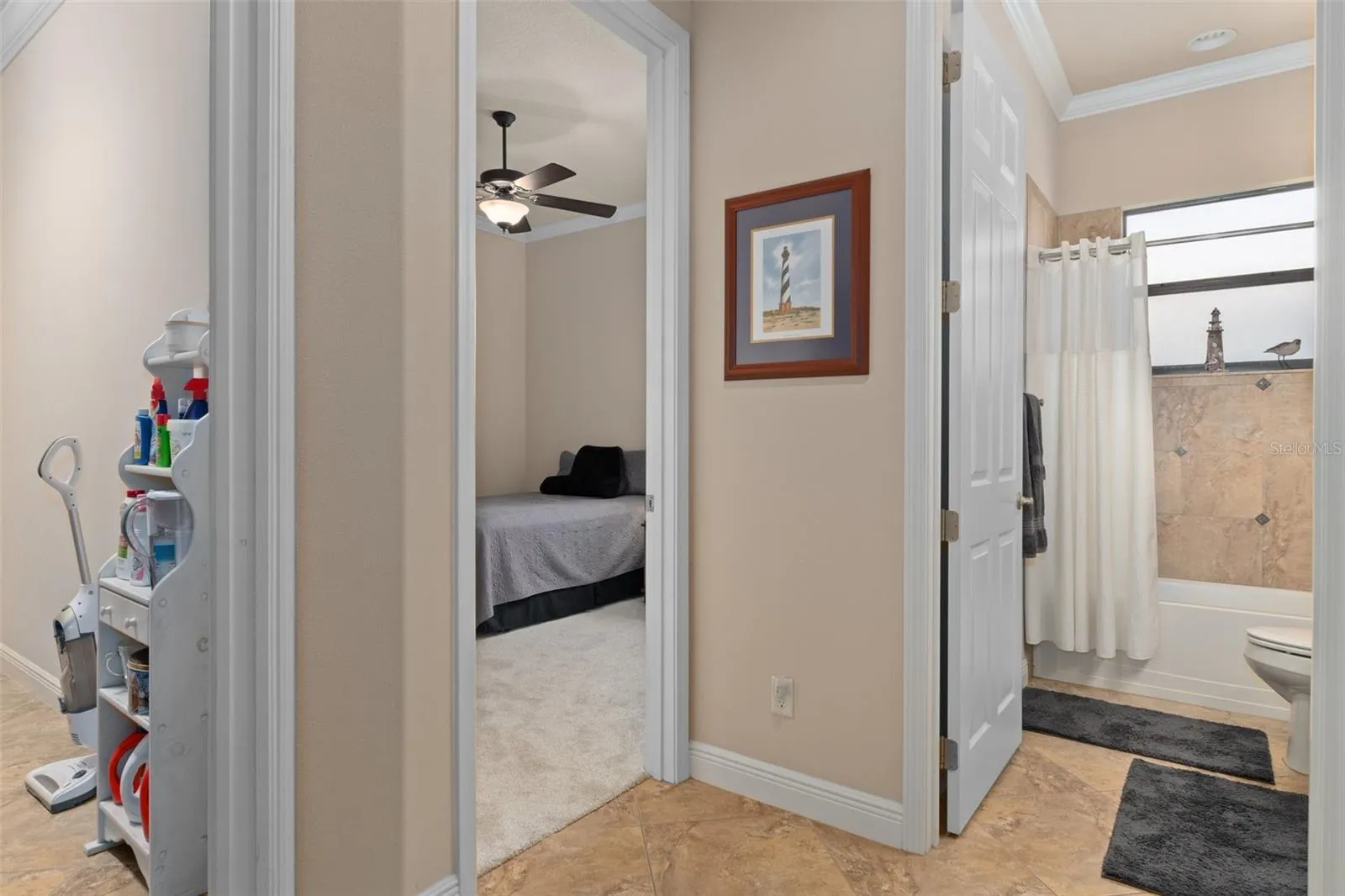 Heading into the guest area you will find the guest bedroom (center door), the guest bath (right), and entry to the laundry room (left). This area can be closed off by a pocket door off of the Great Room, turning this area into a secluded guest area.