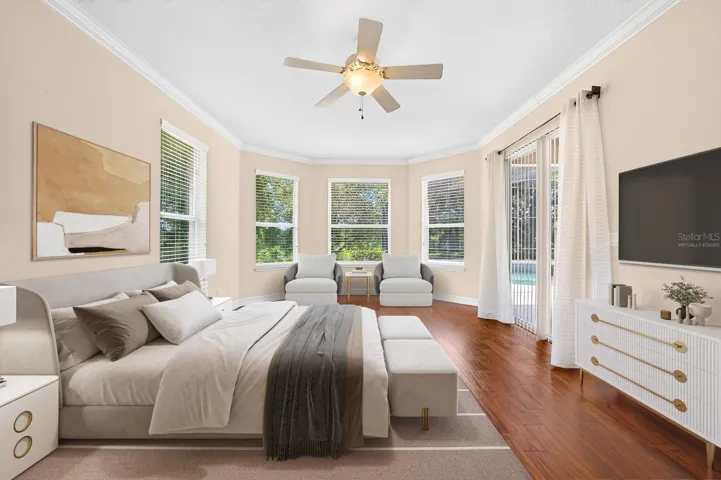 The primary suite becomes your tranquil retreat with a wall of windows and direct access to the lanai/pool. Virtually Staged.