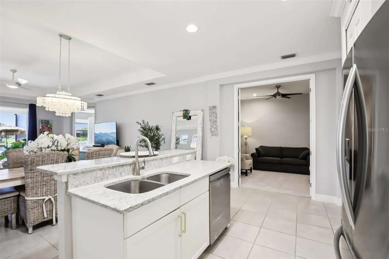 Kitchen view to living room and water view.