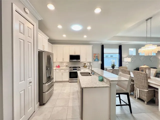 Kitchen with LG Modern Appliances and Gas Cooktop.