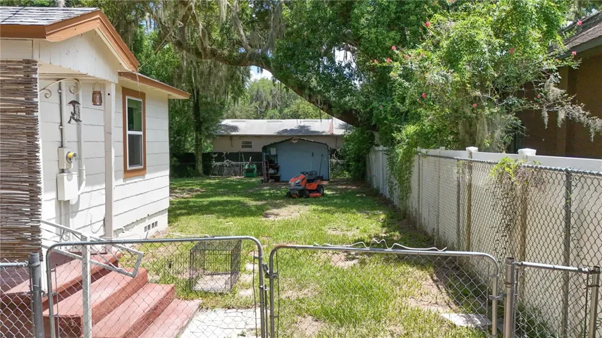 Rear Yard is completely fenced and has large storage shed and workshop in rear