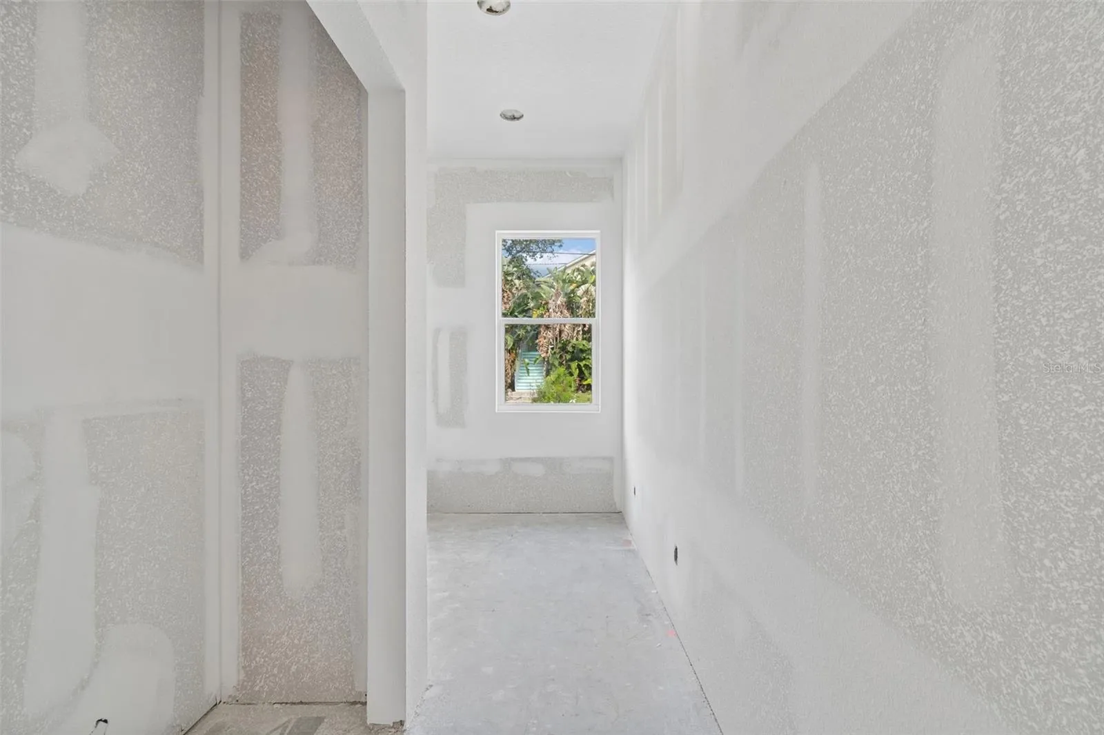 Entry into laundry room with large closet