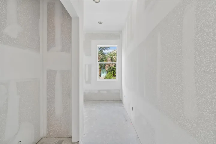 Entry into laundry room with large closet