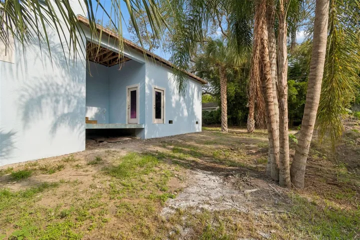 west side of property with a breezeway from the garage