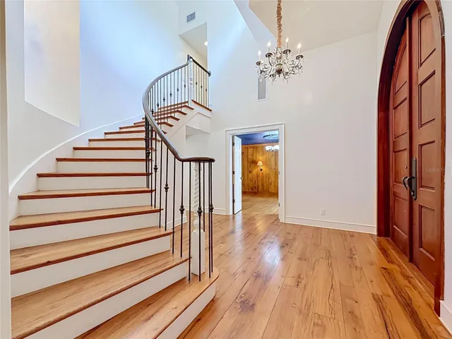 Foyer - Sweeping Staircase - Office and Wine Room