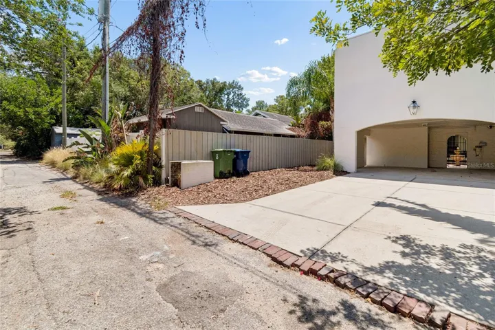 Rare 2 car carport with 2 outside storage rooms and private alleyway pull in