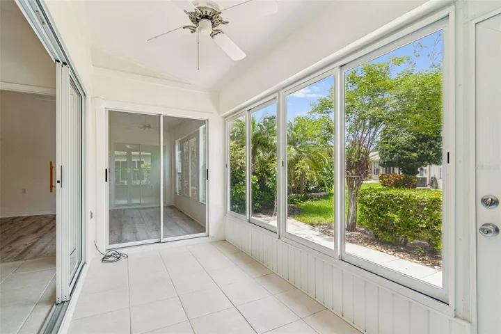 Sun room from Kitchen towards outdoor Patio