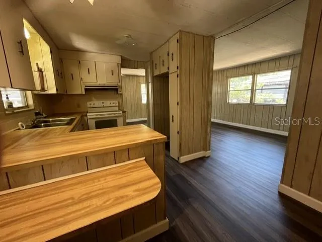 View of Kitchen and Living Room from Carport Door