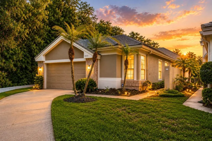 One of Parkside at Lansbrook's premier homes, offering exceptional water and conservation views on a quiet cul-de-sac with mature landscaping and timeless Florida architecture
