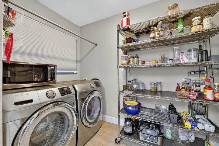 Inside Laundry Room with storage