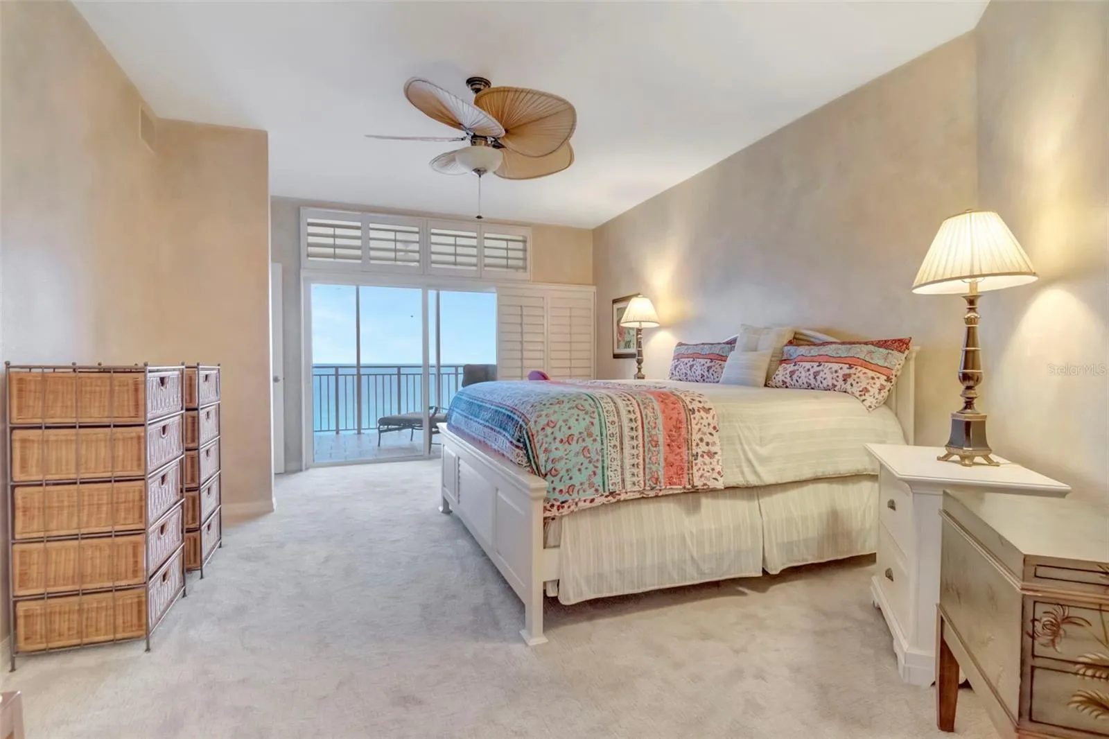 Primary bedroom with access to balcony with Beach Views
