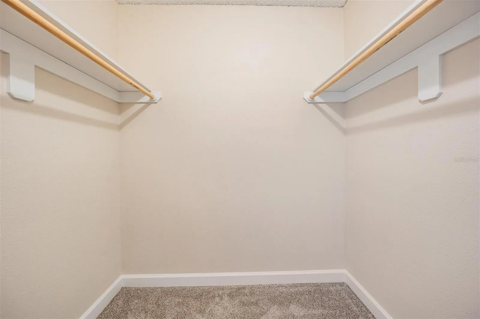 Primary bedroom walk in closet