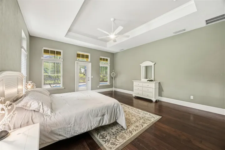 primary bedroom with access / view to pool