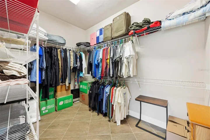 large primary walk-in closet