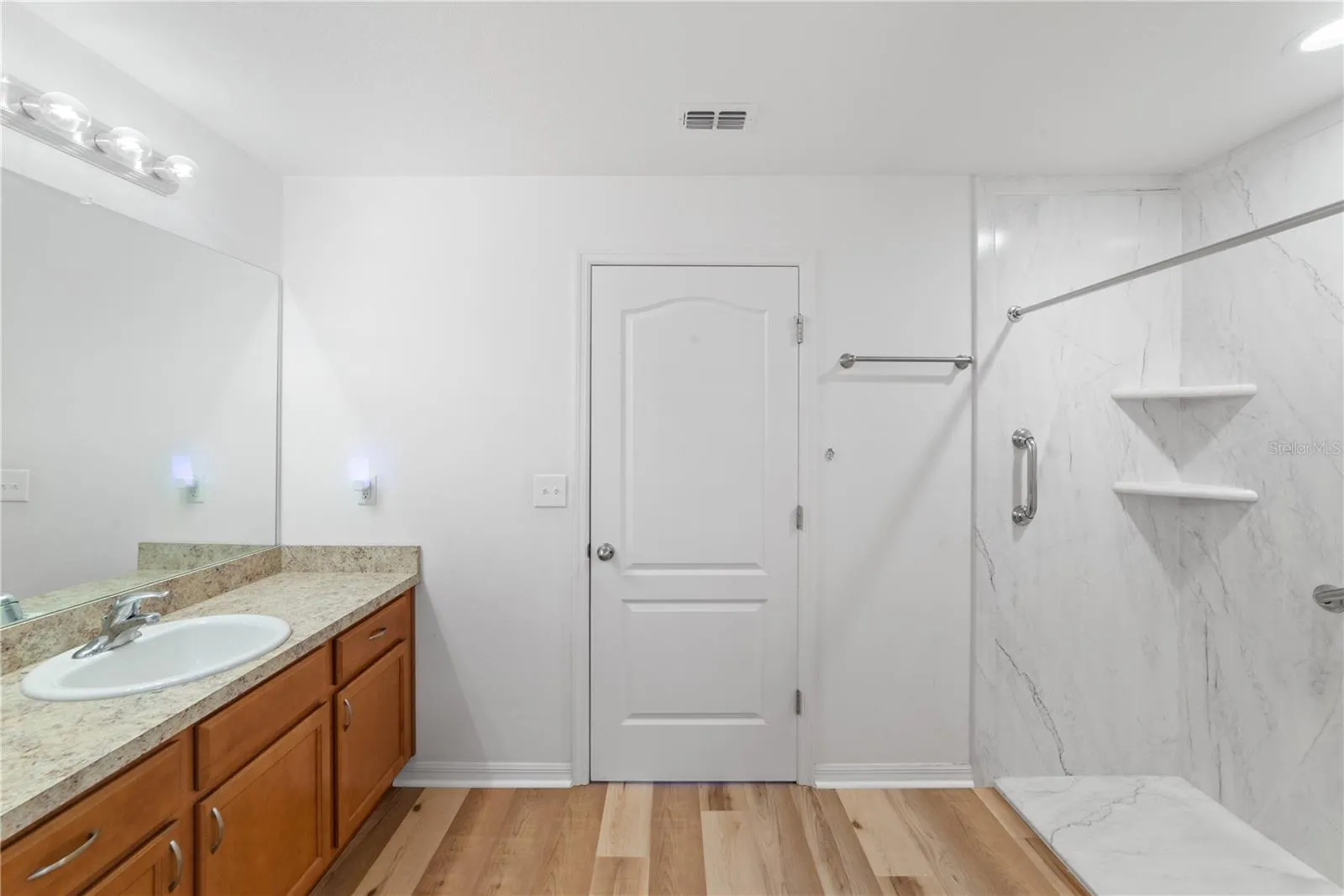 Primary with attached bath and walk in closet.
