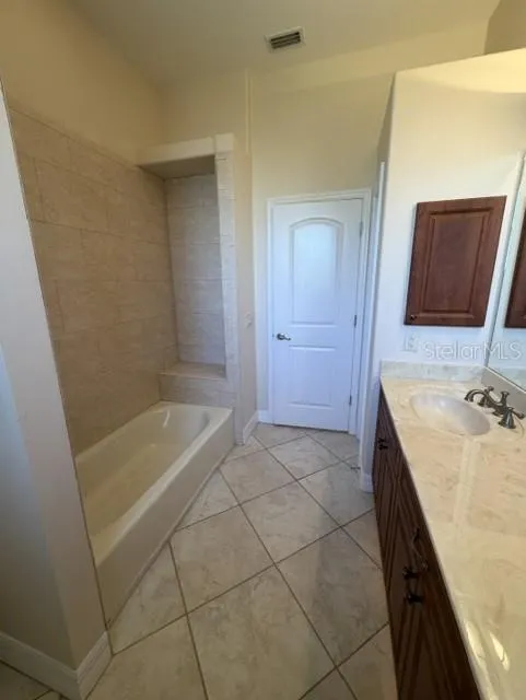Tub with Ledge in Guest Bathroom 1