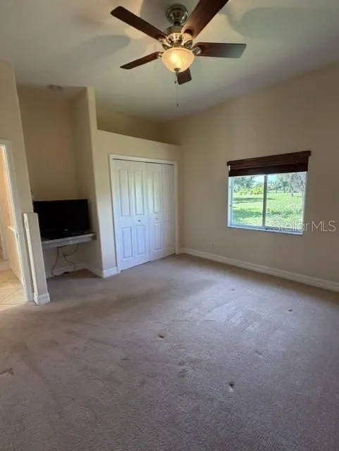 Guest Bedroom 1 with Closet and Desk Area