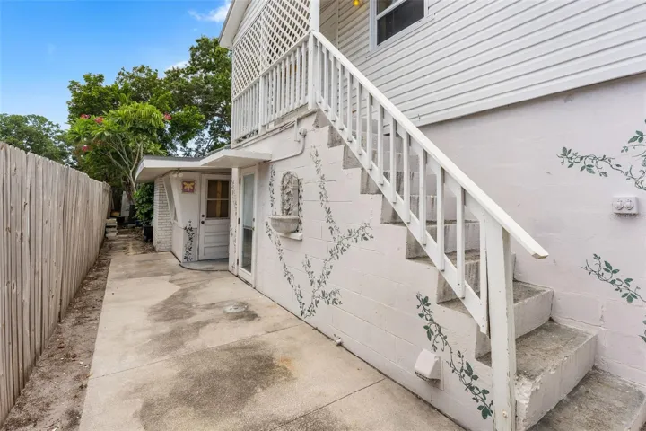 Rear of house; private stairway to primary suite