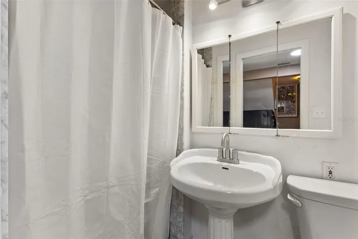 Bath near laundry and bedroom 2